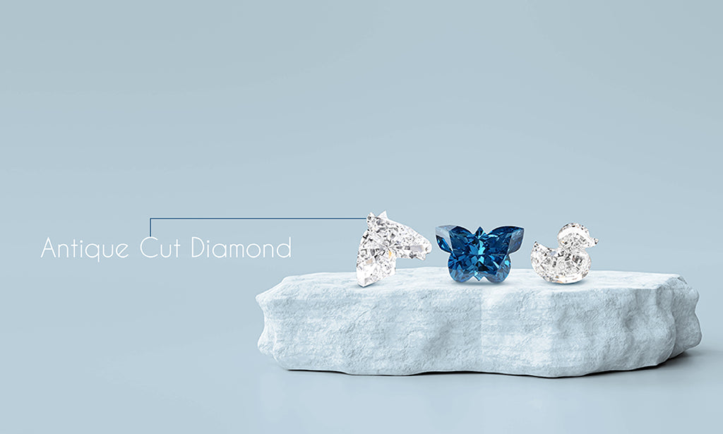  image showing antique-shaped lab-grown diamonds cut in the shapes of a duck, butterfly, and horse
