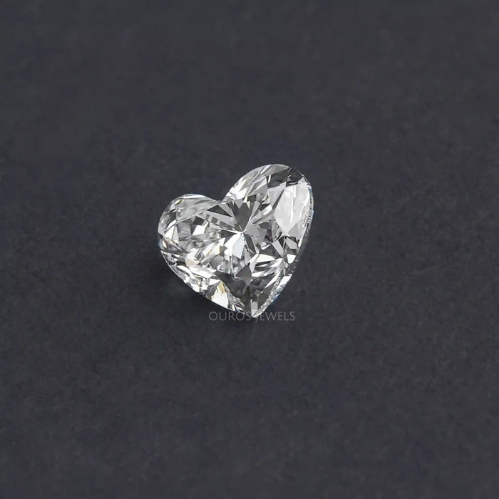1 Carat IGI Certified Heart Cut Lab Grown Diamond on a dark background, showcasing its brilliance and clarity.
