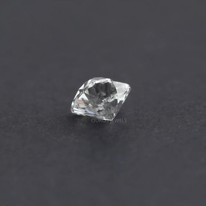 1 Carat IGI Certified Heart Cut Lab Grown Diamond displayed at an angle on a dark background, showcasing its depth and brilliance.