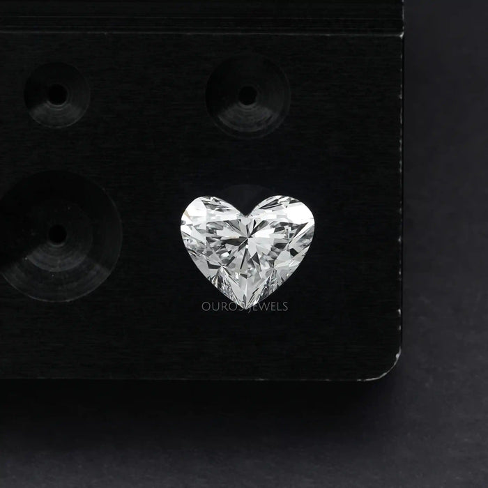 1 Carat IGI Certified Heart Cut Lab Grown Diamond with Black and gray combination background.
