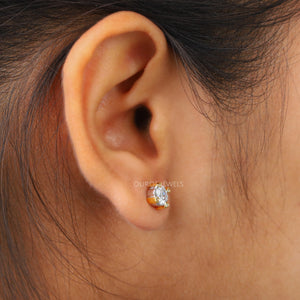 A women wearing Asscher Cut Diamond Two Tone Stud Earrings.