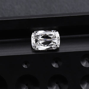 2.23 Carat IGI Certified Criss Cut Lab Diamond displayed on a sleek black metallic surface with round indentations.