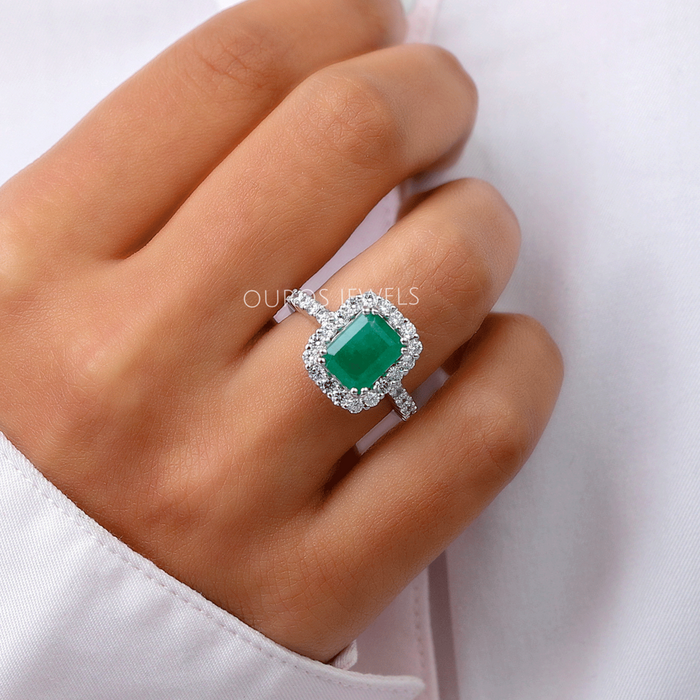 In finger look of natural green gemstone diamond engagement ring comes in halo setting 