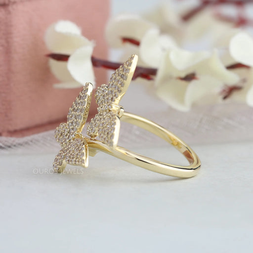 side view of butterfly-shaped round lab diamond bypass cluster engagement ring