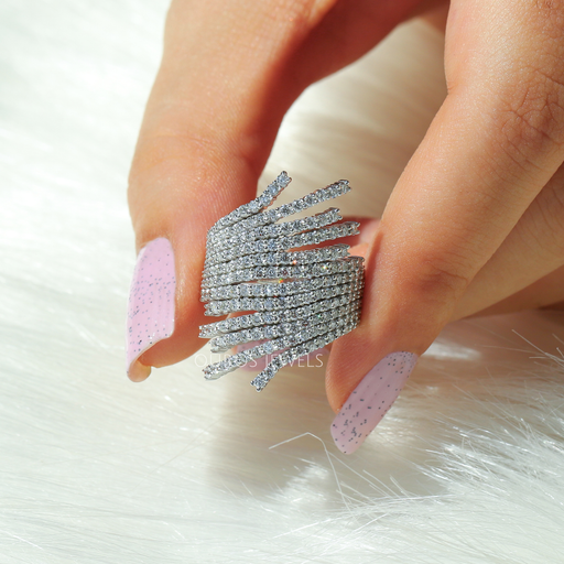 close view of round-cut lab diamond multi-row bypass engagement ring